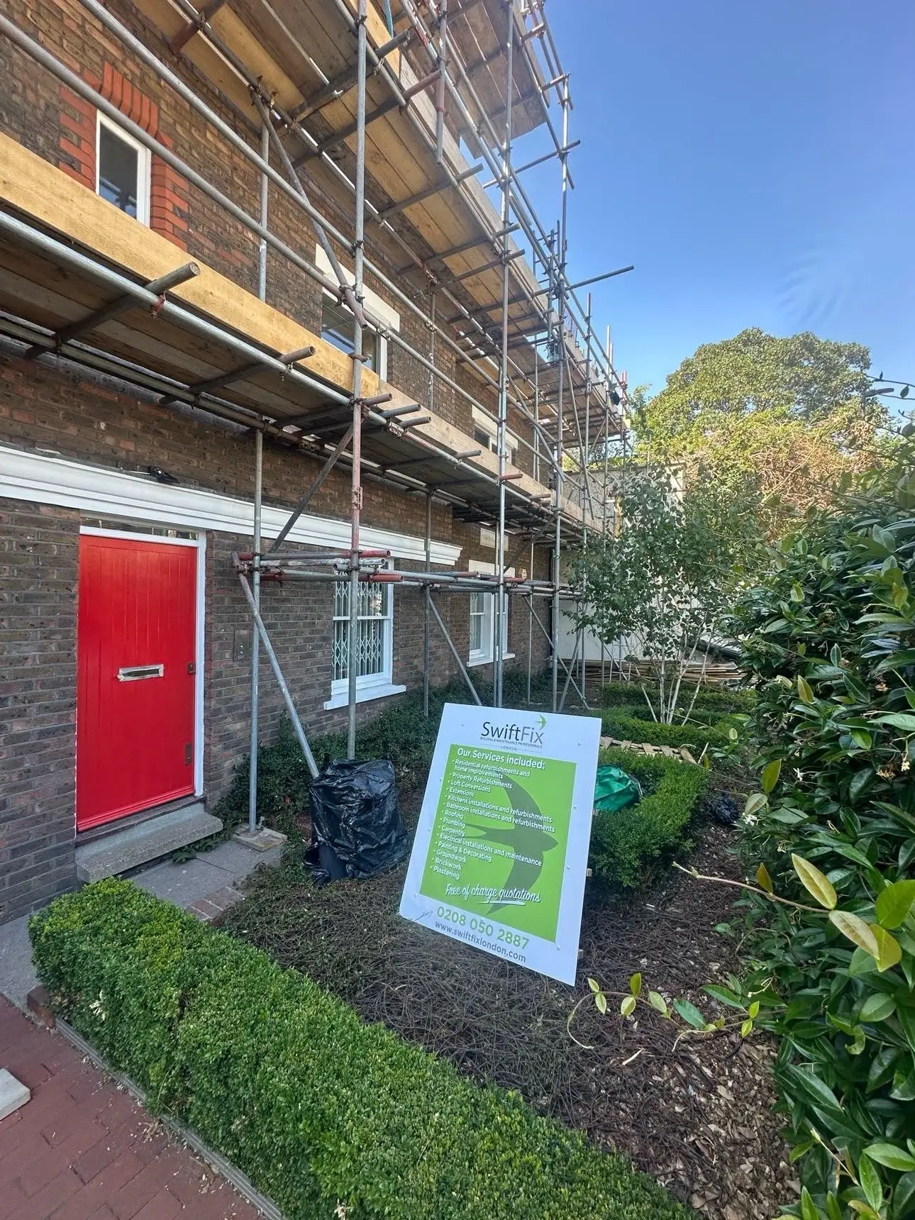 House scaffolded for building works