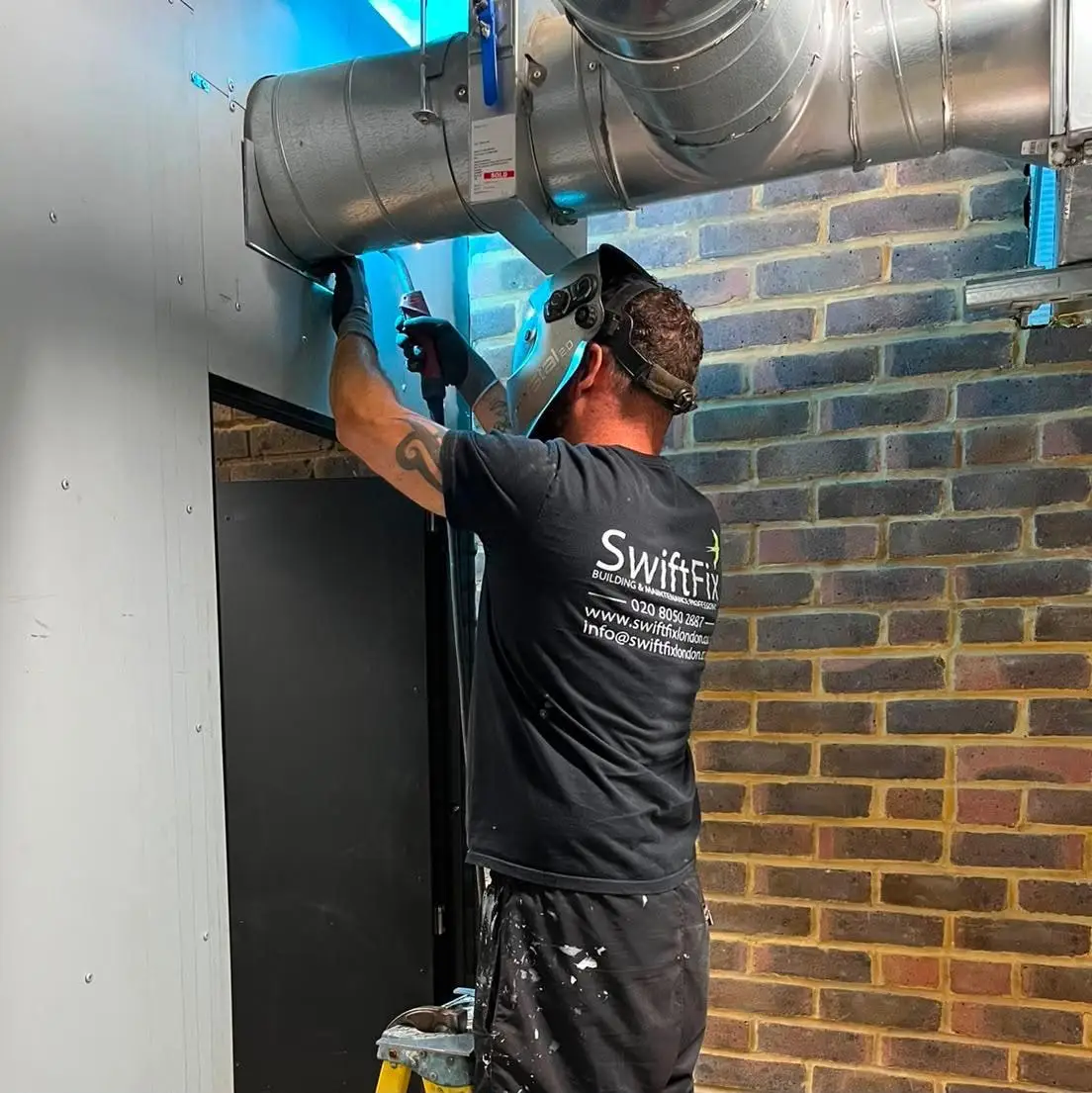 Ductwork being fitted to an external wall