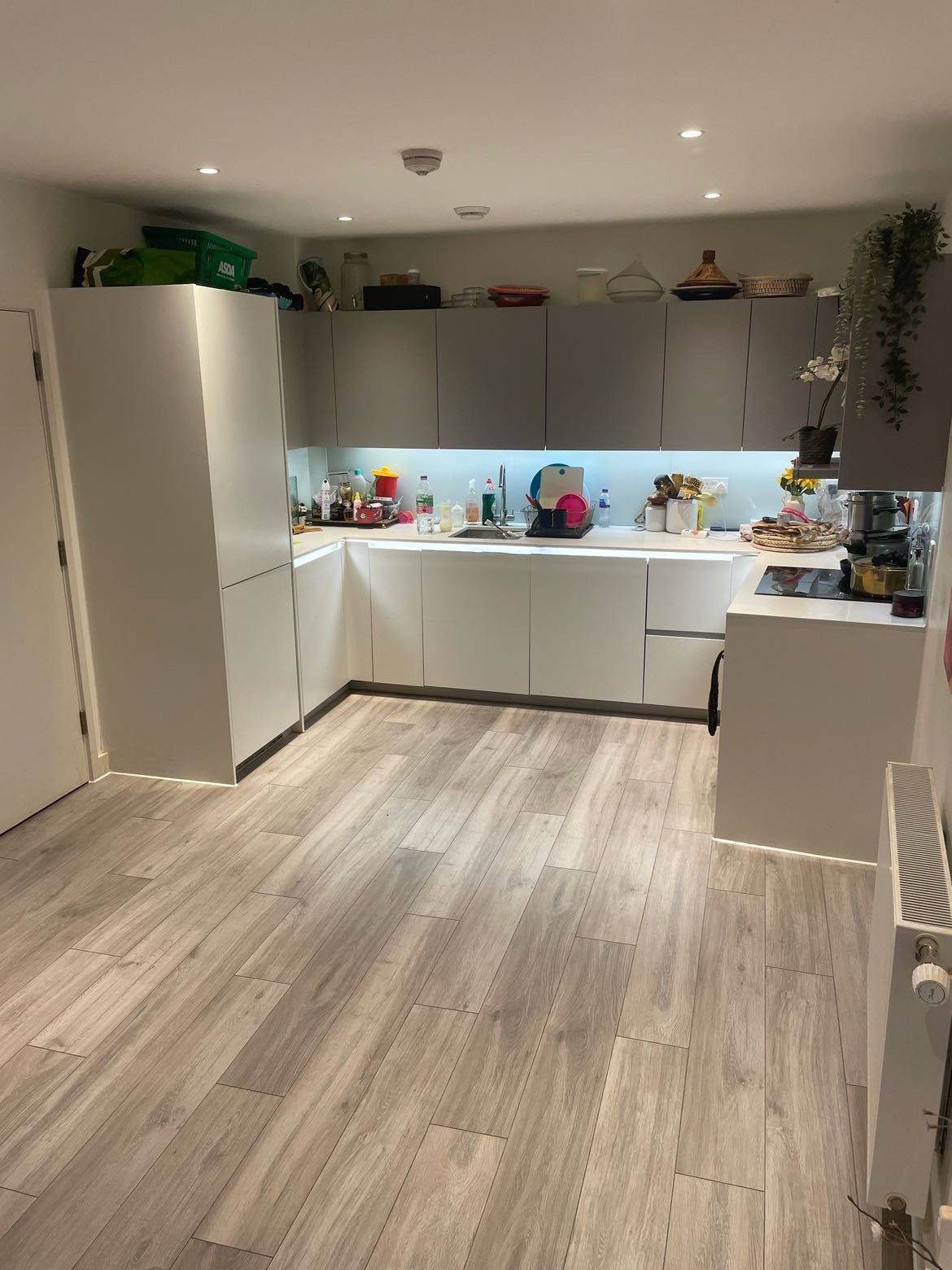 Modern kitchen installation by SwiftFix London with sleek cabinets and integrated appliances.